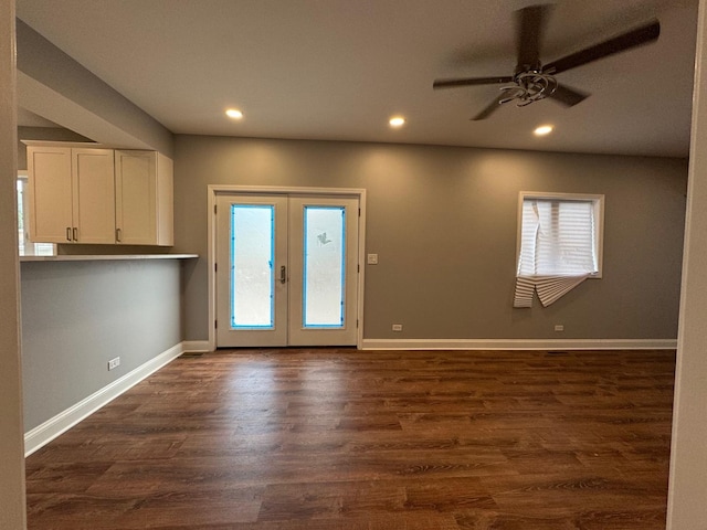 interior space featuring dark hardwood / wood-style floors, ceiling fan, and french doors