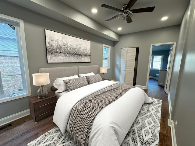 bedroom with ceiling fan and dark wood-type flooring