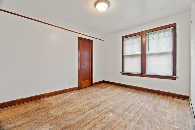 unfurnished room with light wood-type flooring