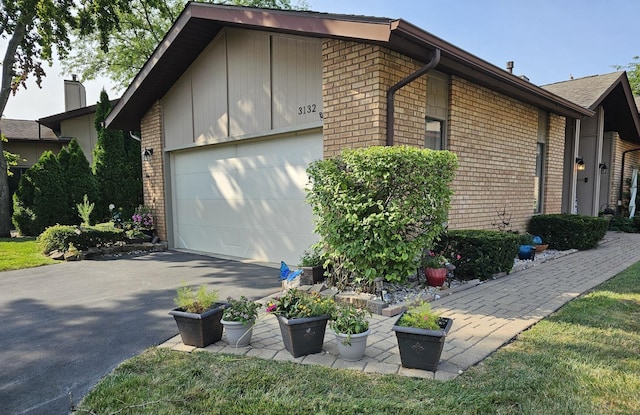 3132 Stonegate Ct, Flossmoor, IL 60422 - view of home's exterior with driveway, brick siding, and a garage