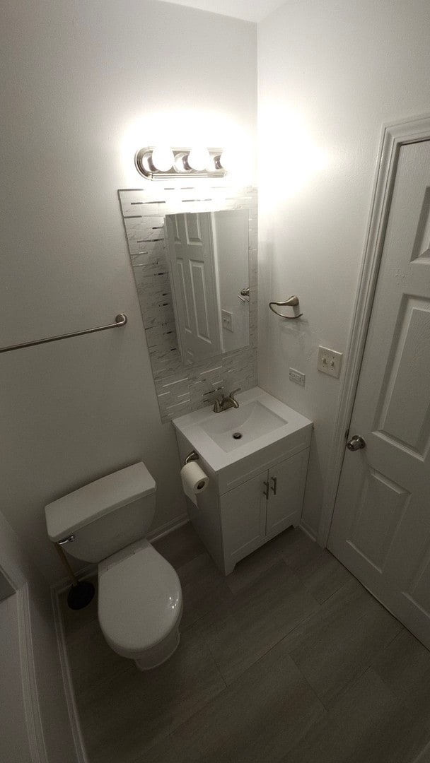 bathroom featuring vanity, toilet, and tile patterned floors