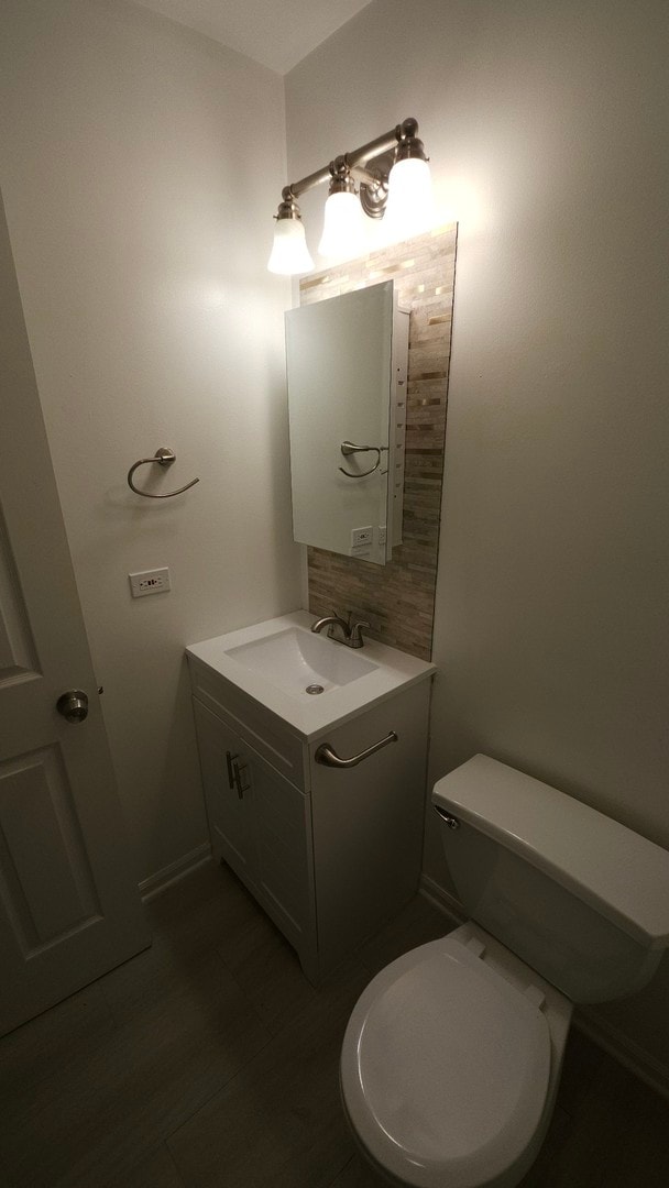 bathroom with toilet and vanity