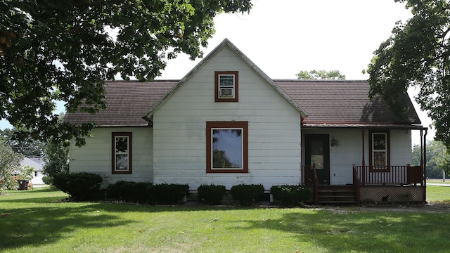 view of front facade with covered porch and a front yard