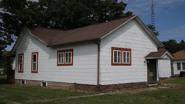 view of property exterior featuring a yard