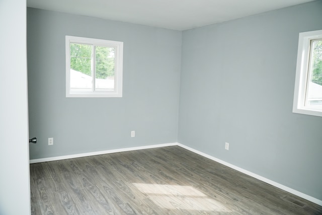 spare room featuring dark hardwood / wood-style floors