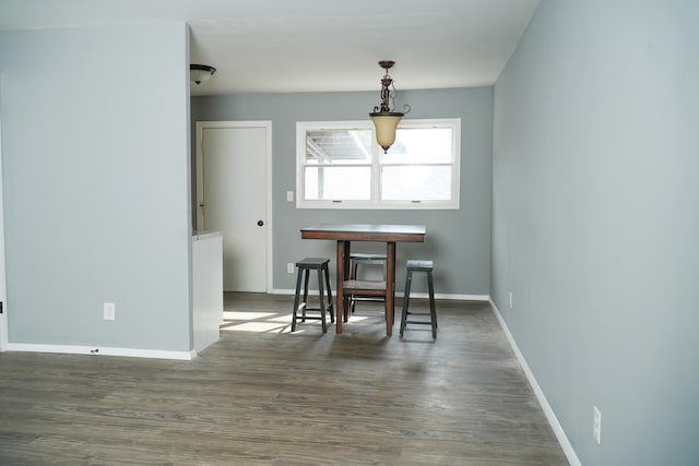 dining space featuring dark hardwood / wood-style floors