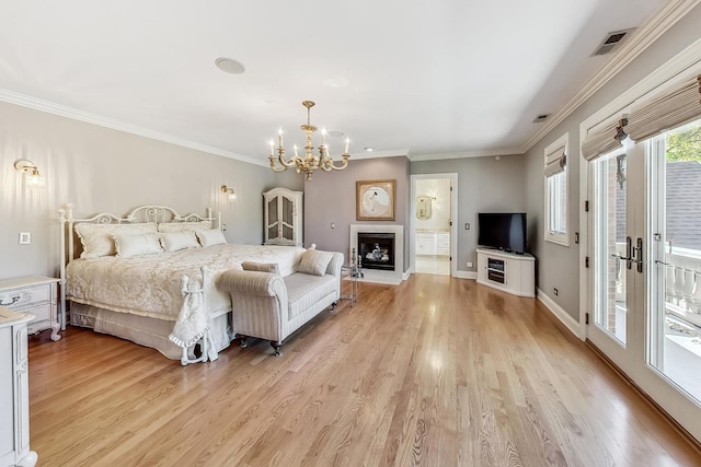 bedroom with access to exterior, ensuite bath, crown molding, a notable chandelier, and light hardwood / wood-style floors