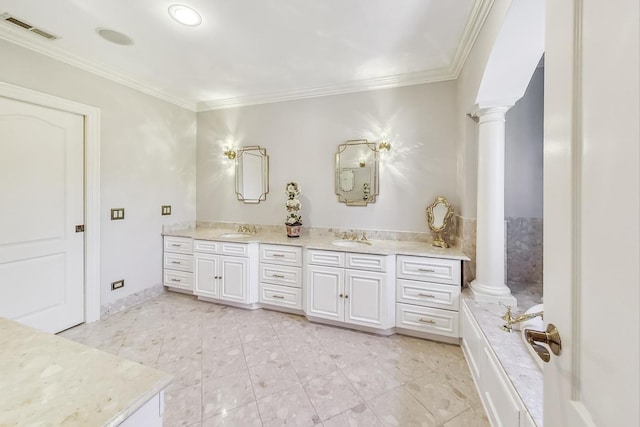 bathroom with vanity, crown molding, and ornate columns