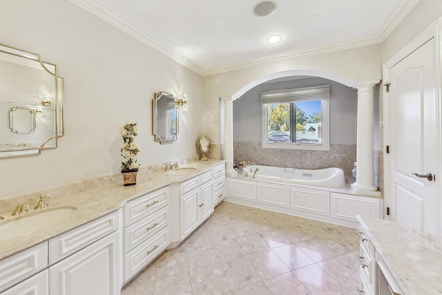 bathroom featuring a bathtub, decorative columns, vanity, crown molding, and tile patterned flooring