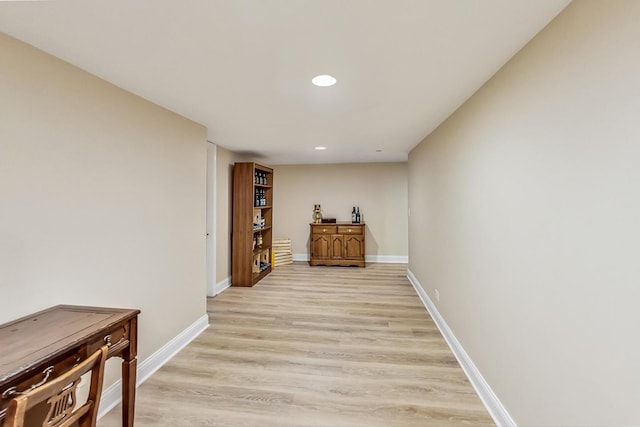 corridor featuring light hardwood / wood-style floors