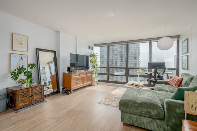 1636 N Wells St Unit 1907, Chicago, IL 60614 - living area with an office area, light wood-style flooring, and a wall of windows