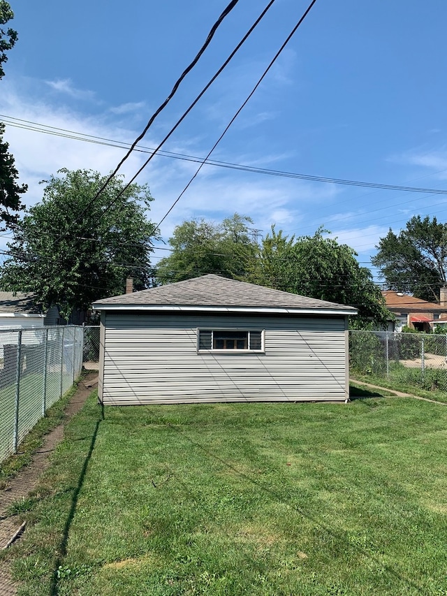 view of outdoor structure with a lawn