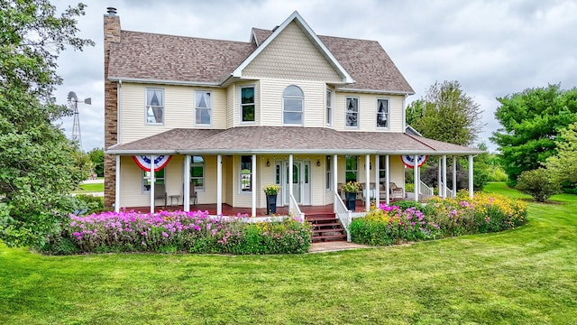 view of front facade featuring covered porch and a front yard