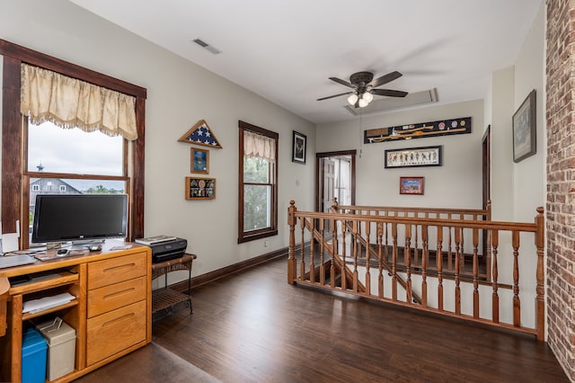 office area with ceiling fan and dark hardwood / wood-style floors