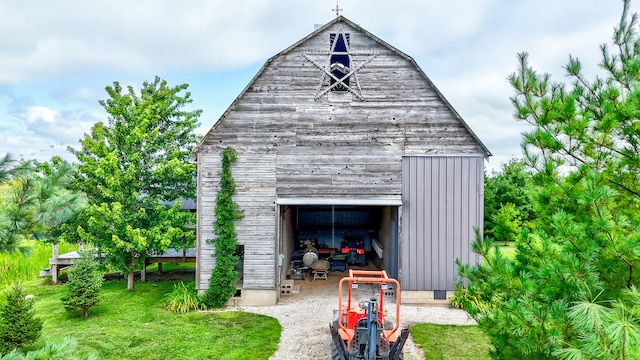 view of outdoor structure with a lawn