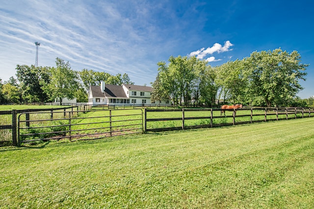 view of yard with a rural view