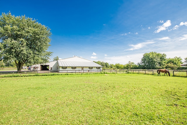 view of yard with a rural view