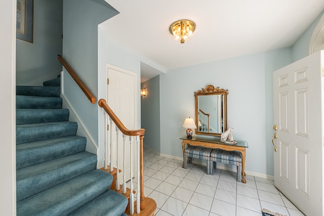 staircase with tile patterned flooring