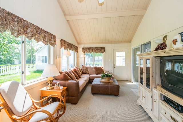 sunroom featuring vaulted ceiling with beams