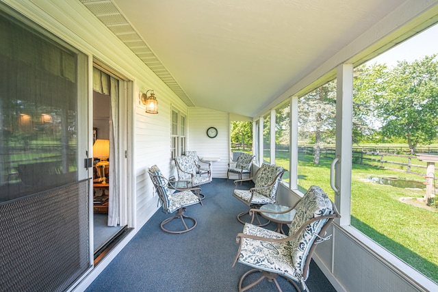 sunroom / solarium featuring plenty of natural light