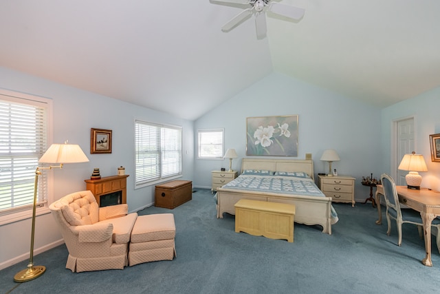 carpeted bedroom featuring ceiling fan, vaulted ceiling, and multiple windows