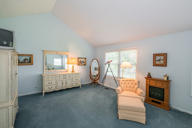 sitting room featuring carpet floors and high vaulted ceiling