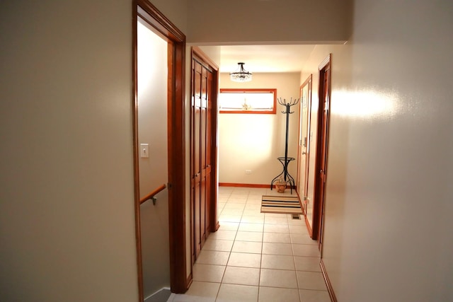 hallway featuring light tile patterned floors