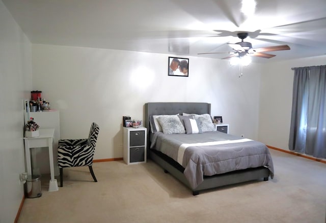 bedroom featuring light carpet and ceiling fan