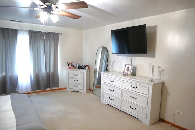 bedroom with light colored carpet and ceiling fan