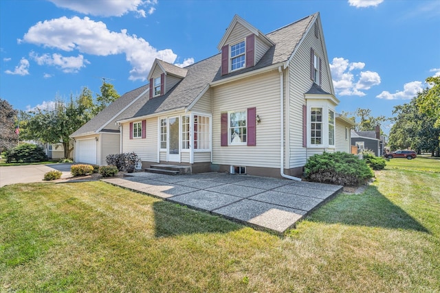 exterior space featuring a garage and a yard