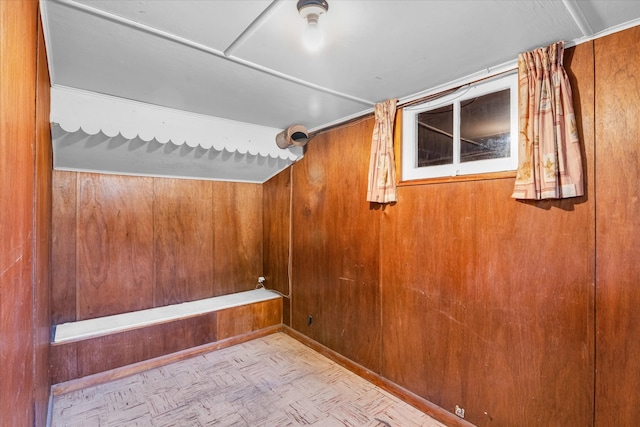 interior space featuring wooden walls