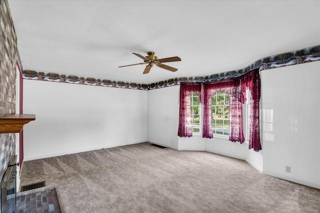 empty room with ceiling fan and carpet