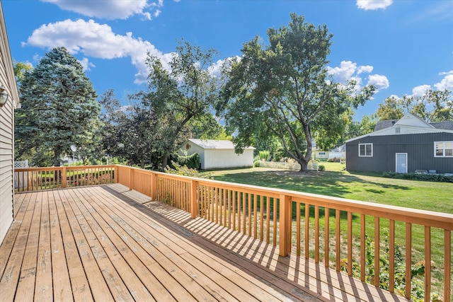 deck featuring a lawn and a shed