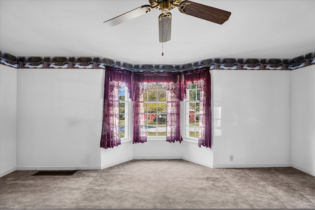 carpeted empty room with ceiling fan