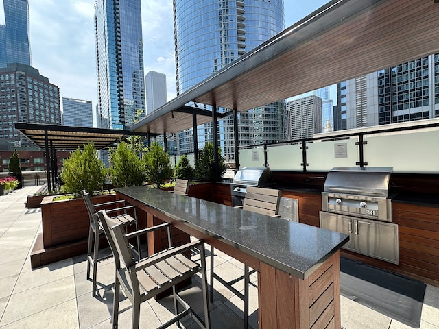 view of patio / terrace with exterior kitchen and grilling area