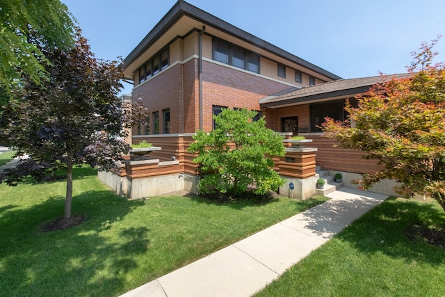 view of home's exterior with a lawn