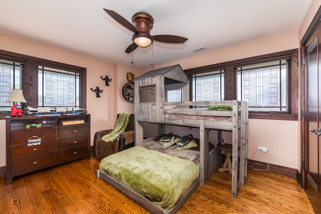 bedroom featuring hardwood / wood-style flooring and ceiling fan