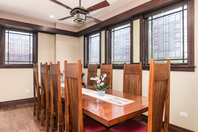 dining area with hardwood / wood-style flooring and ceiling fan