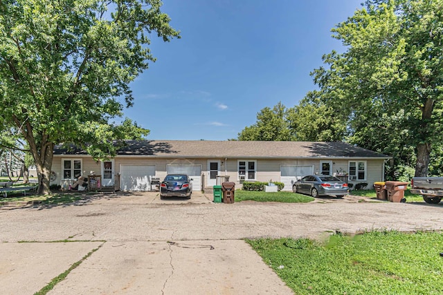 ranch-style house featuring a garage