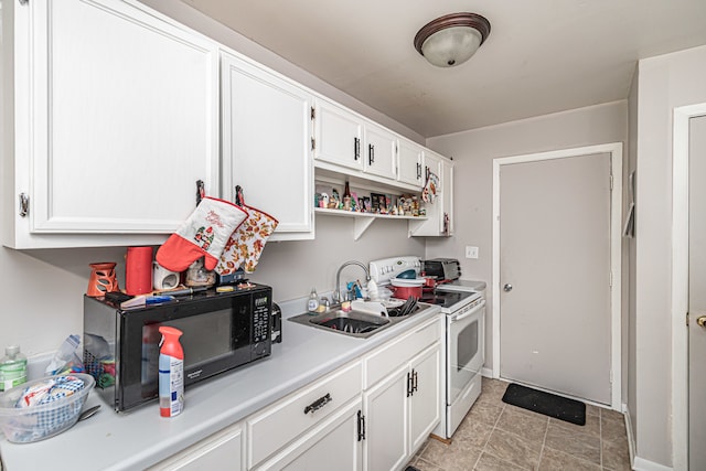 kitchen with white range with electric stovetop, light tile patterned floors, white cabinets, and sink