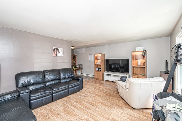 living room featuring light wood-type flooring and a baseboard radiator