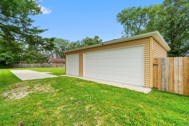 garage featuring a yard