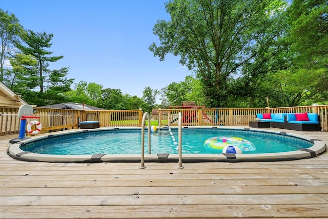 view of swimming pool featuring a deck