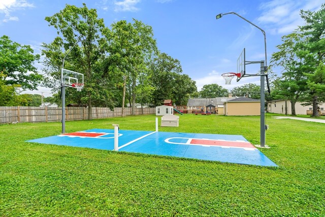 view of jungle gym featuring a yard and a wooden deck