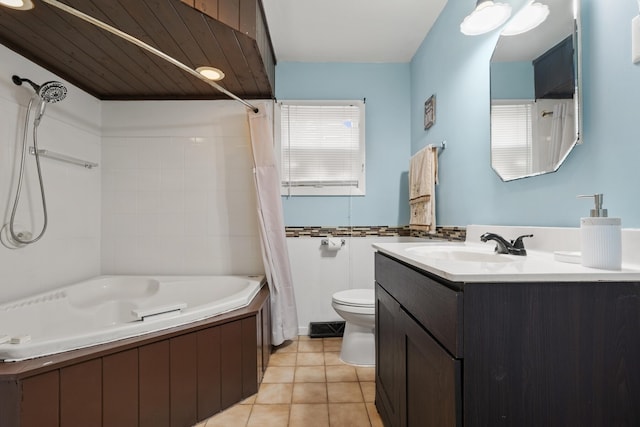 full bathroom featuring vanity, toilet, tile patterned floors, and shower / bath combo with shower curtain