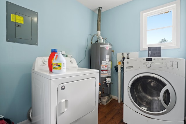 laundry area featuring washing machine and clothes dryer, wood-type flooring, electric panel, and water heater