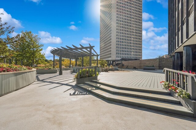 exterior space with a pergola and a deck