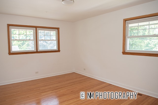 unfurnished room with light hardwood / wood-style floors and a wealth of natural light