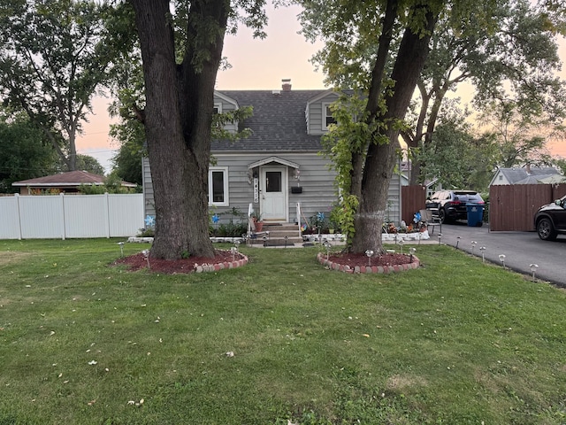 view of front of home with a lawn