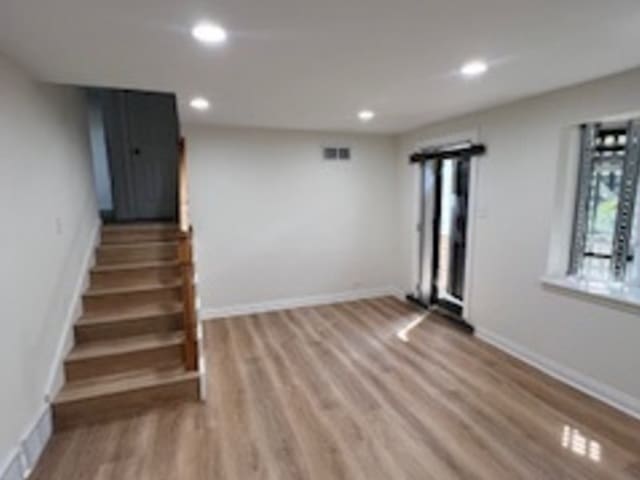 interior space with hardwood / wood-style floors